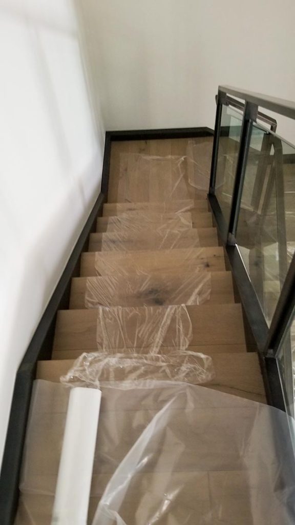 Plastic sheeting runner up the stairs.